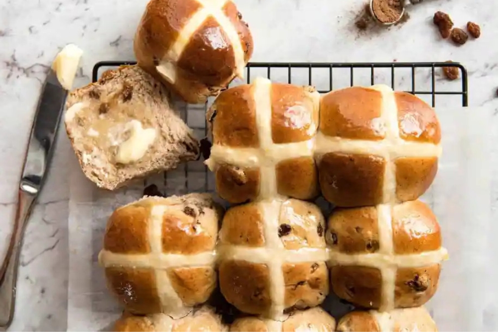 hot cross buns on a cooling rack
