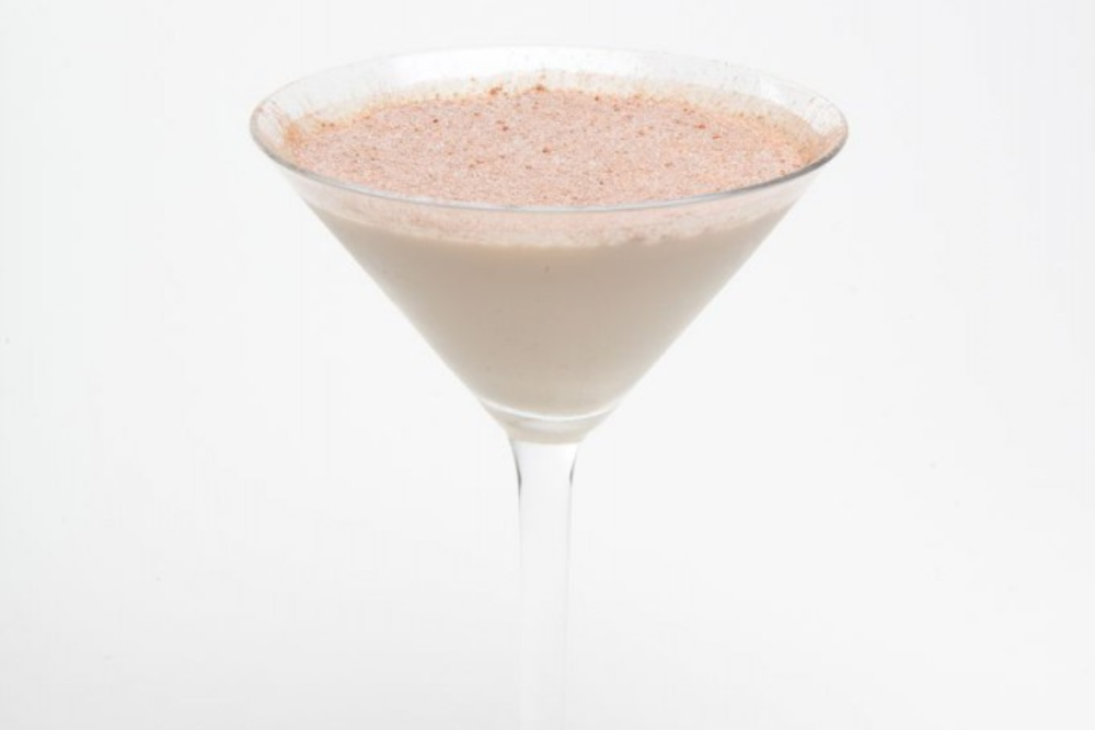 A decadent looking toblerone martini, dusted with cocoa powder